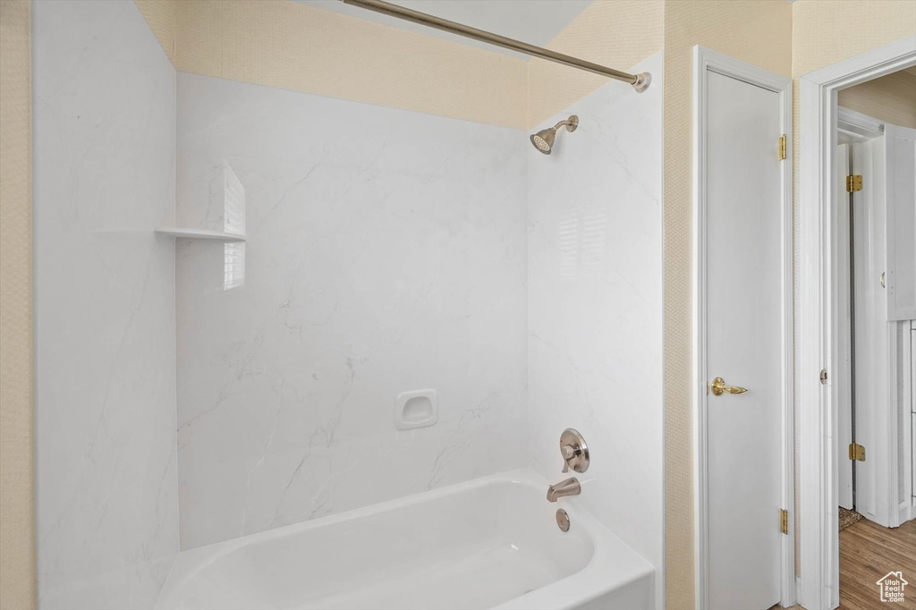 Full bath featuring bathing tub / shower combination