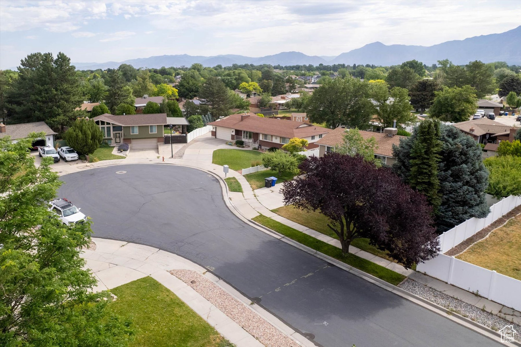 Aerial perspective of suburban area featuring a mountainous background