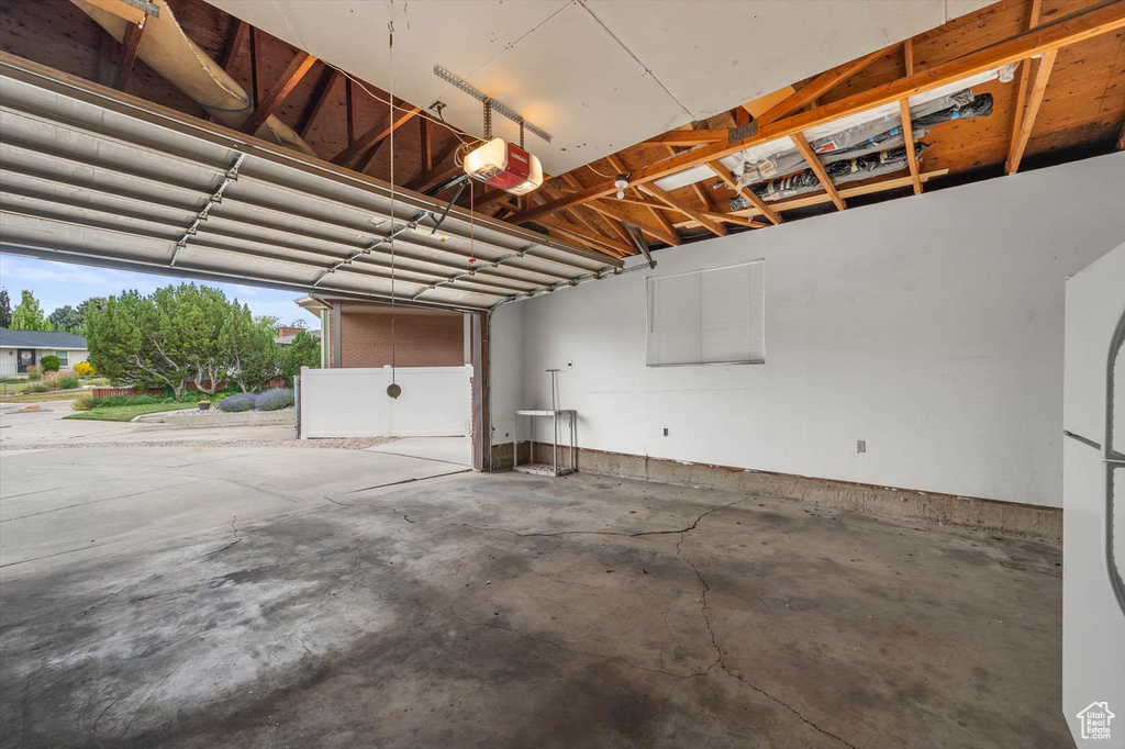 Garage featuring a garage door opener