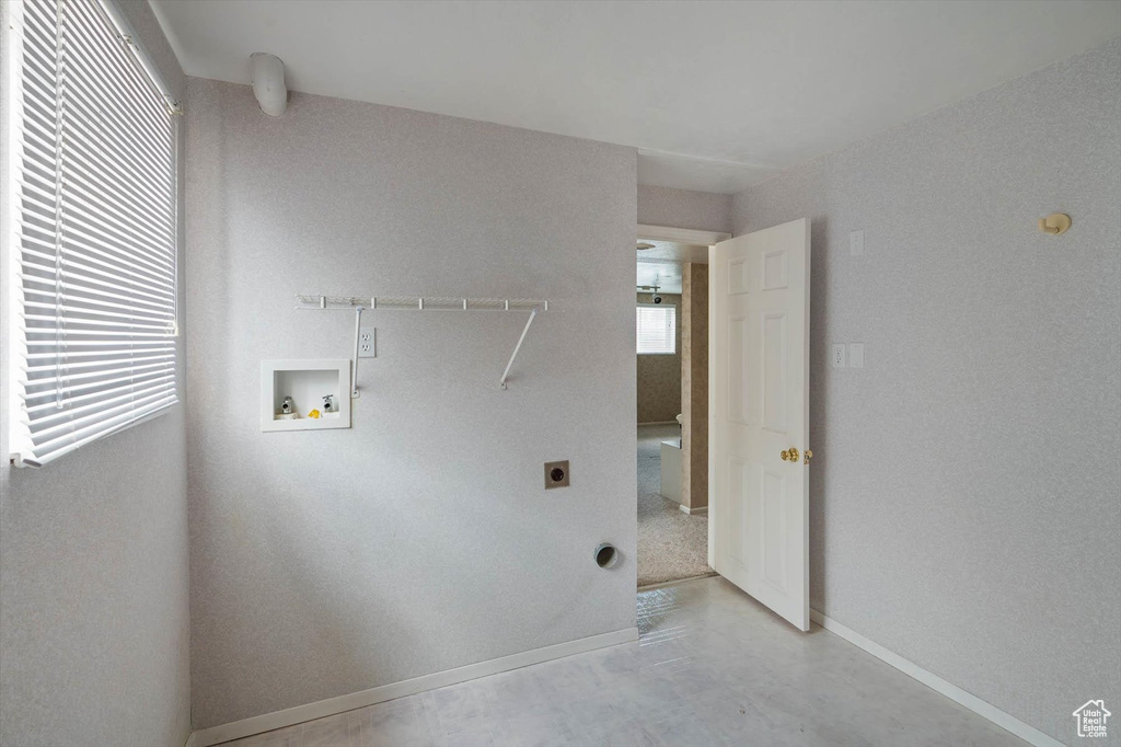 Laundry area featuring hookup for a washing machine and hookup for an electric dryer