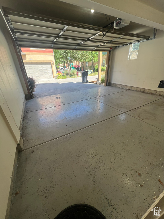 Garage featuring a garage door opener