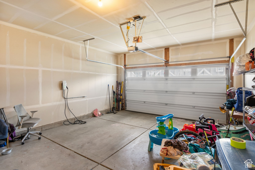 Garage featuring a garage door opener