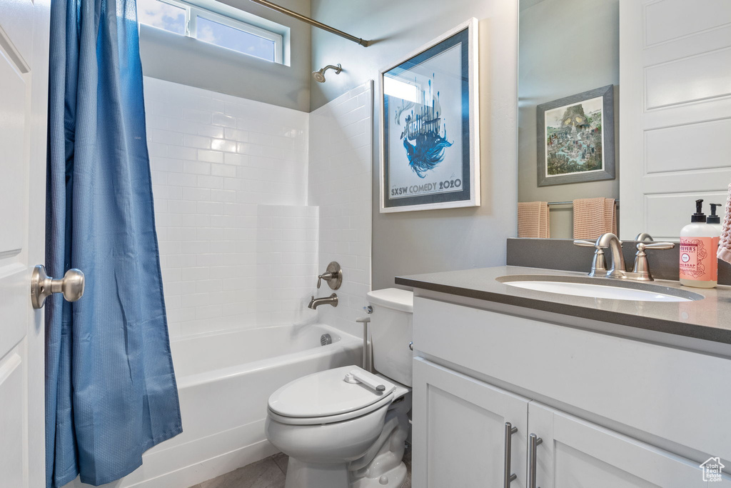 Full bathroom featuring shower / tub combo and vanity