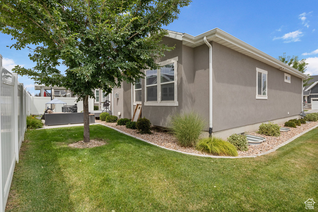View of property exterior with stucco siding