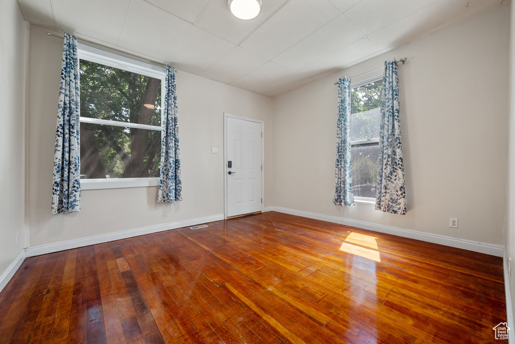 Unfurnished room featuring wood-type flooring