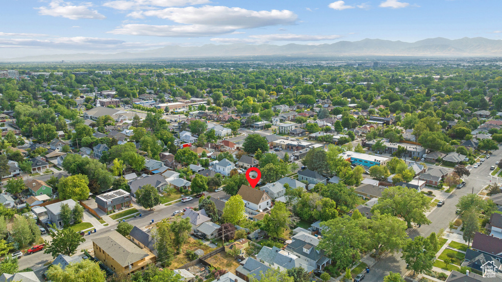 Aerial overview of property\'s location featuring a mountainous background