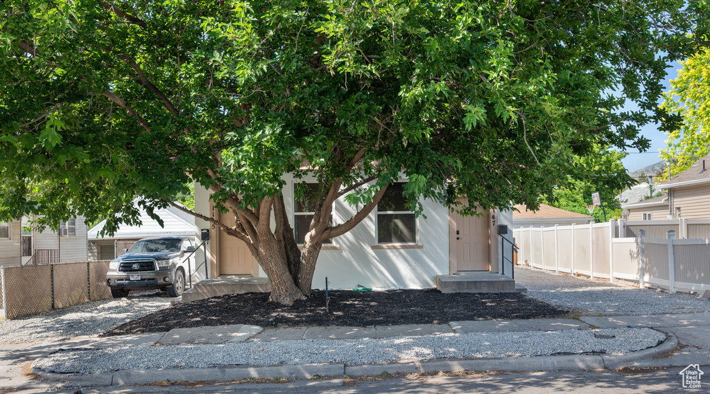 View of property hidden behind natural elements