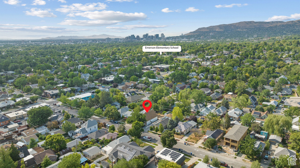 Aerial view of property\'s location with a mountainous background