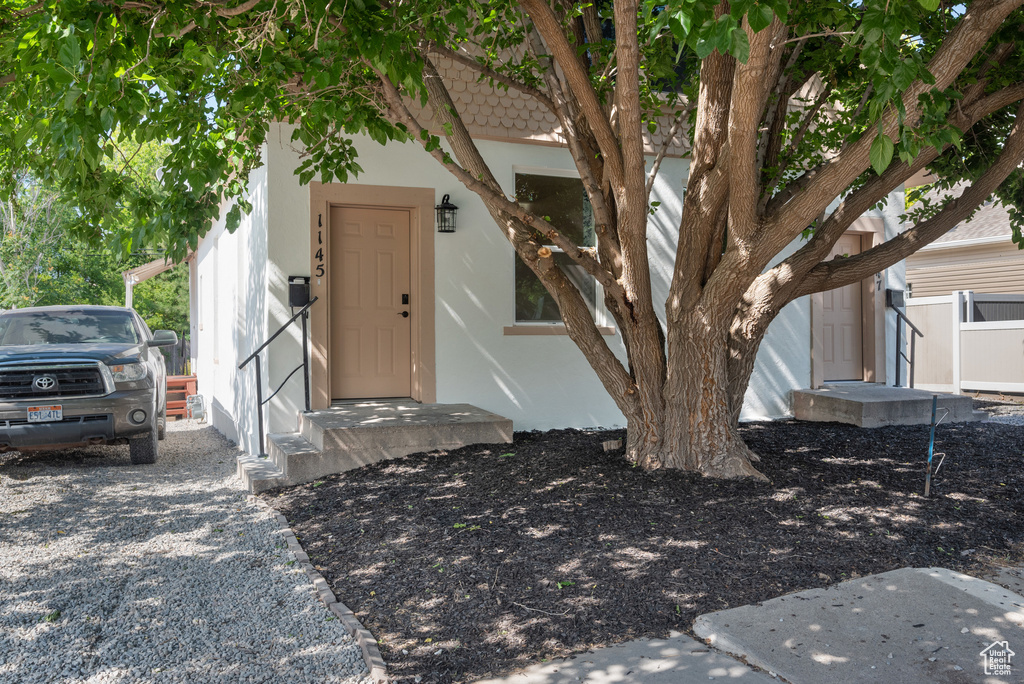 Doorway to property with stucco siding