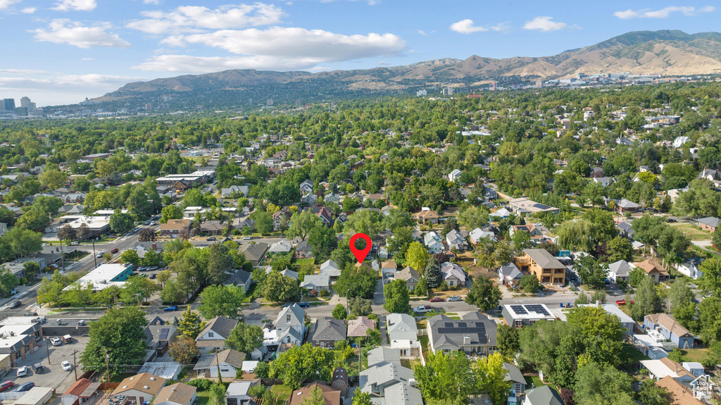 Aerial view of property\'s location featuring a mountain backdrop