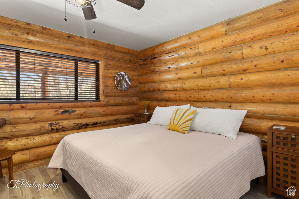 Bedroom with wood finished floors