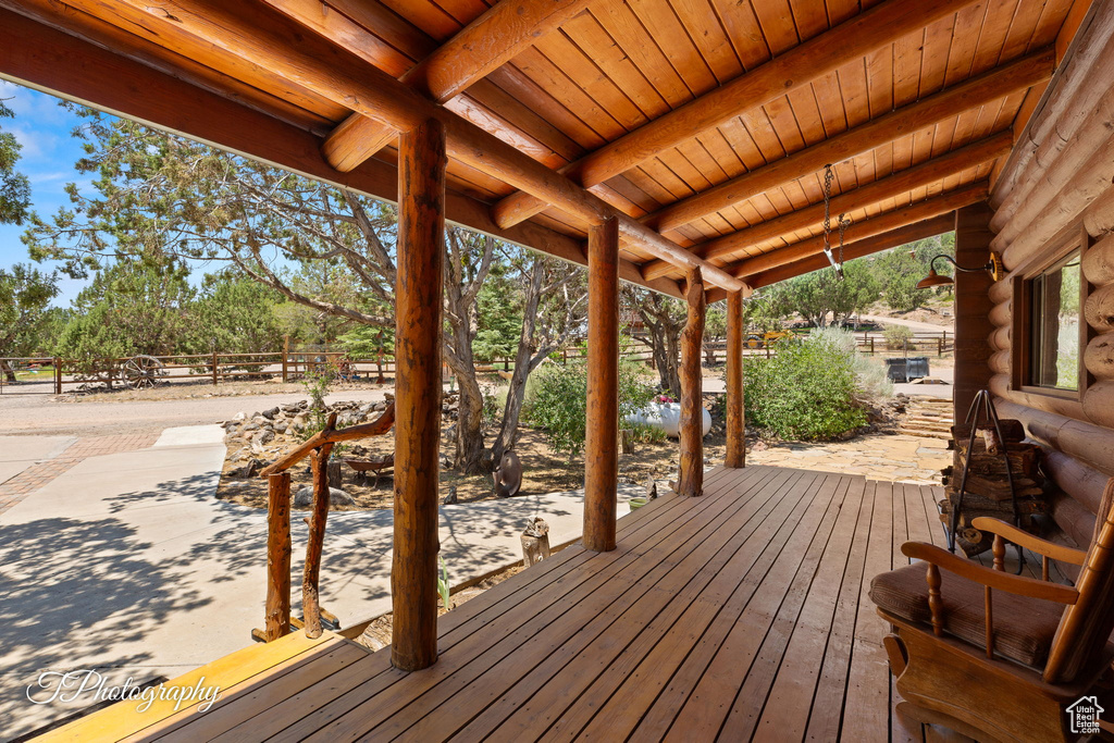 Wooden terrace with view of scattered trees
