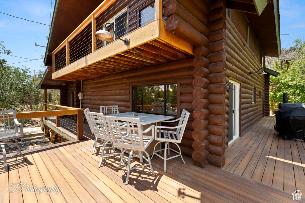 Deck featuring outdoor dining space and area for grilling