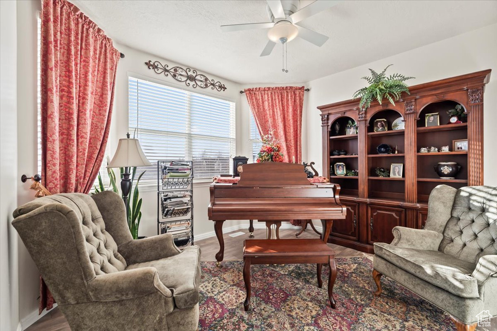 Living area featuring a ceiling fan and wood finished floors
