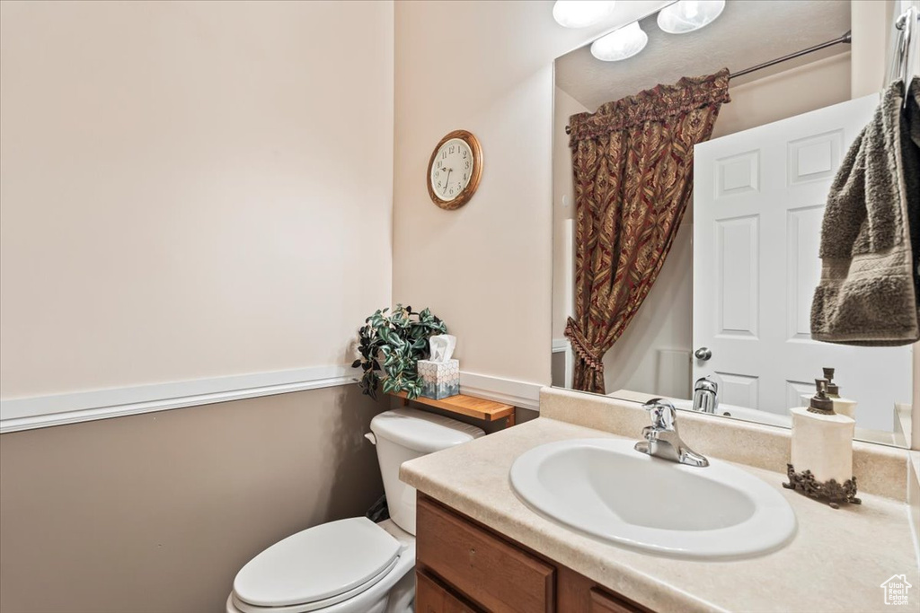 Bathroom featuring toilet and vanity