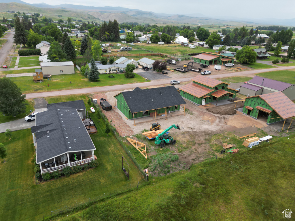 Aerial view of residential area featuring mountains