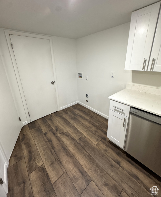 Laundry room with dark wood-type flooring and washer hookup