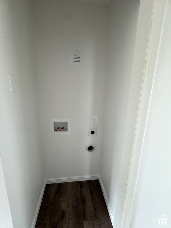 Washroom with electric dryer hookup, dark wood-style floors, and hookup for a washing machine