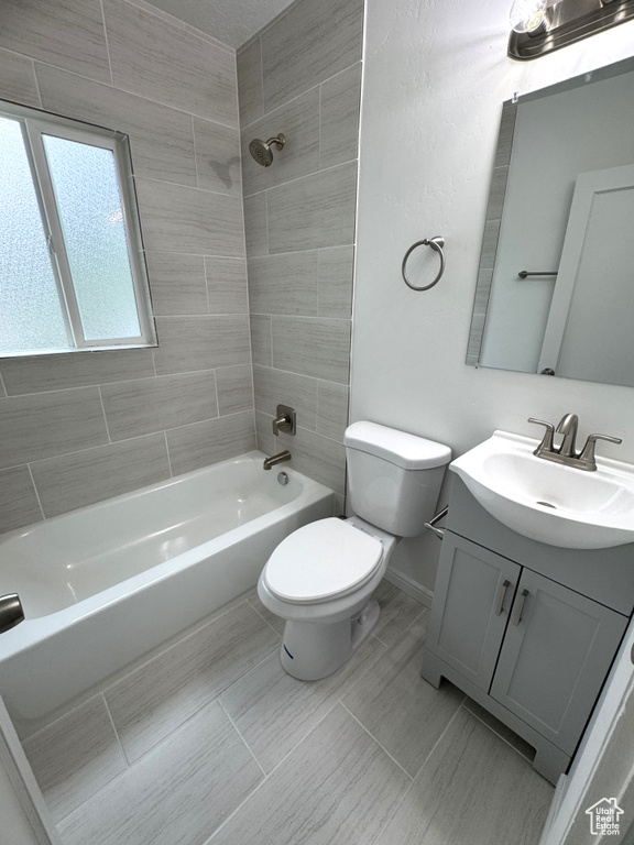 Bathroom featuring vanity and shower / tub combination