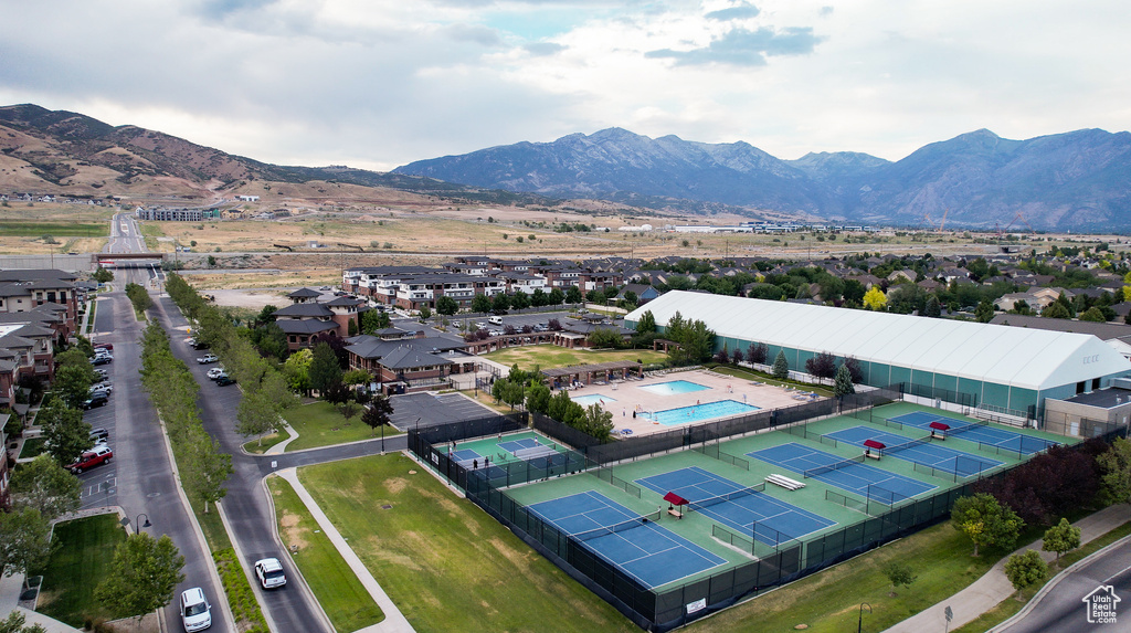 Bird\'s eye view of a mountain backdrop and a pool