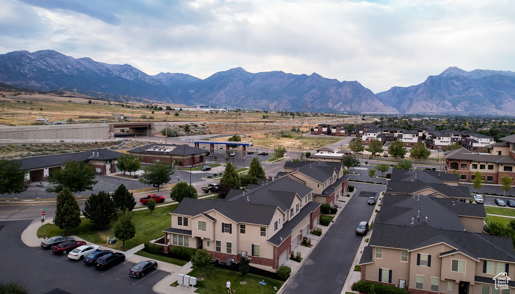 Aerial view of residential area featuring a mountain backdrop