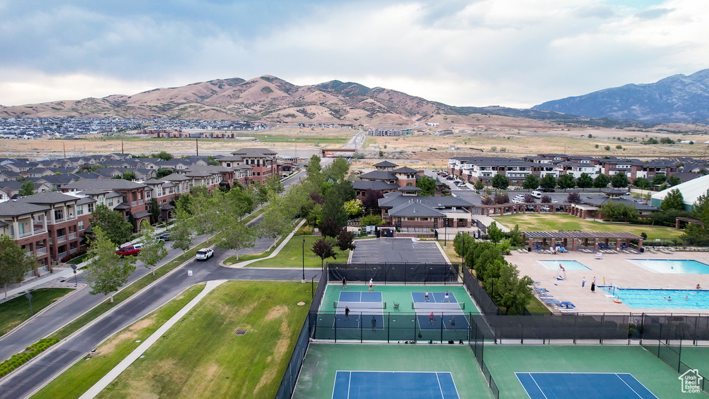 Aerial view of property\'s location featuring a mountainous background and nearby suburban area