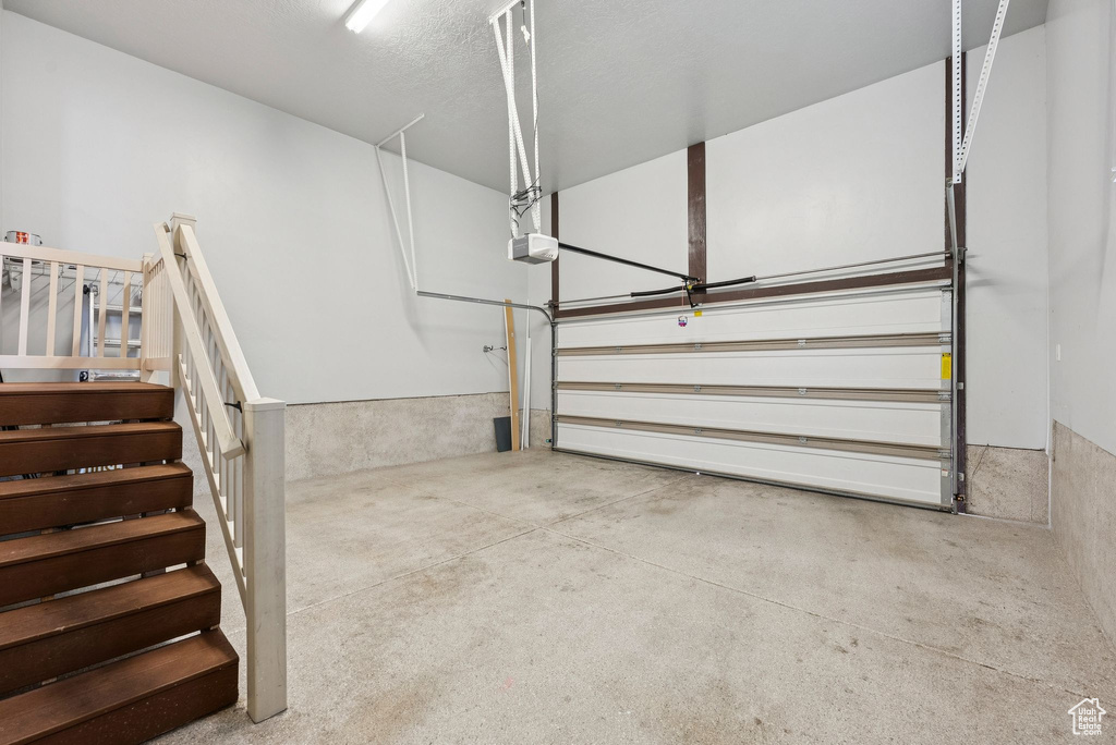Garage featuring a garage door opener