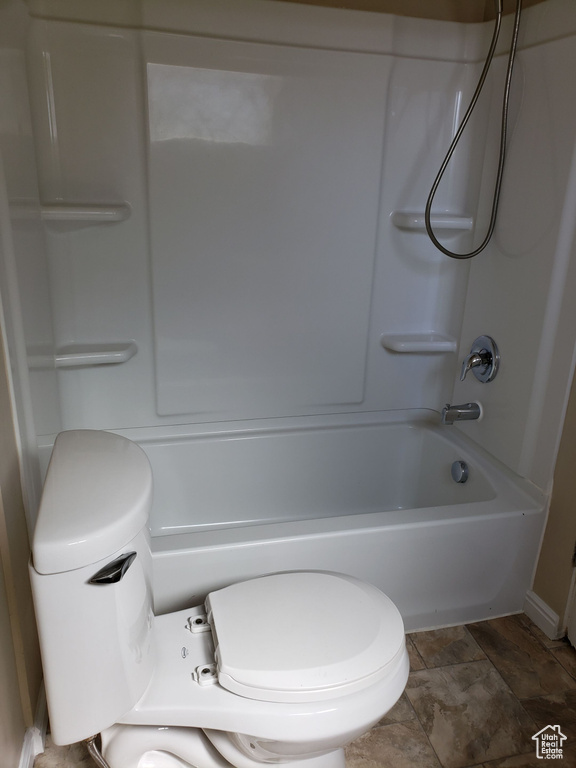 Bathroom featuring  shower combination and toilet