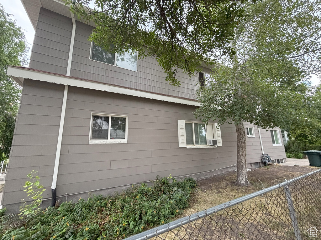 View of property exterior with a fenced backyard