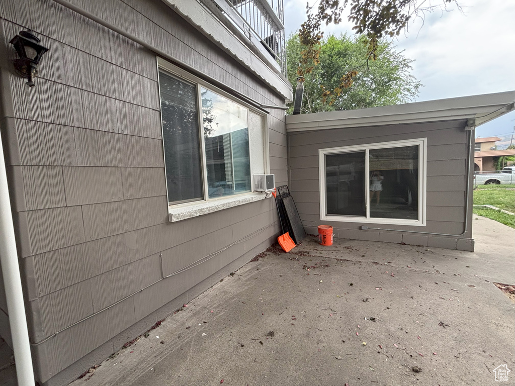 View of side of property featuring a patio