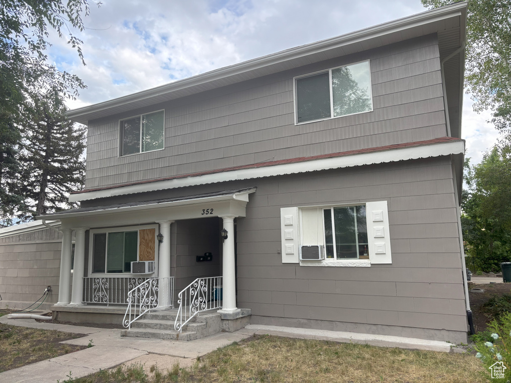 View of front of house with cooling unit