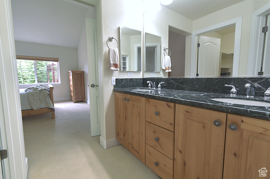Full bath featuring double vanity