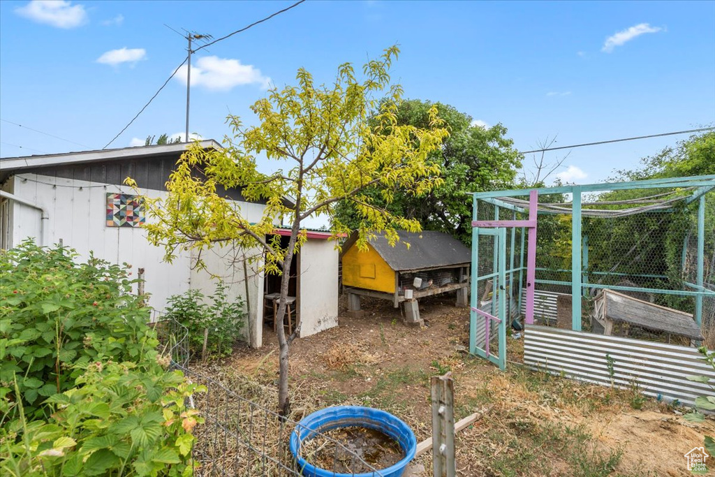 View of yard with exterior structure and an outdoor structure