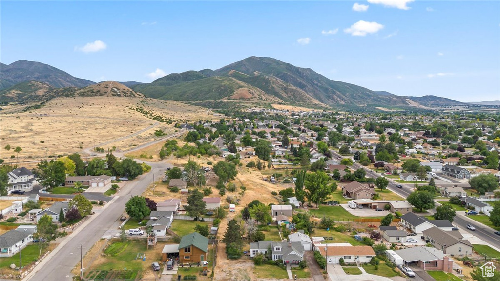 Aerial view of property\\\'s location with nearby suburban area and a mountain backdrop
