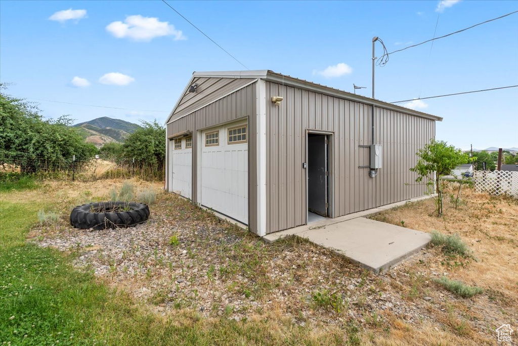 Detached garage with a mountain view