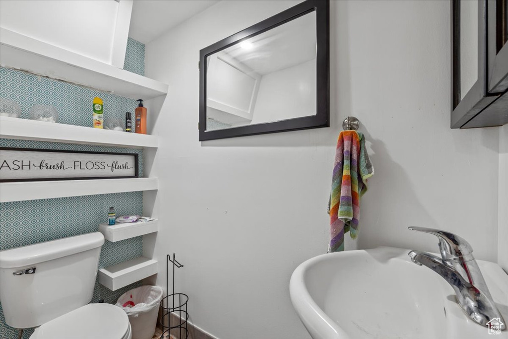 Bathroom featuring a sink and toilet