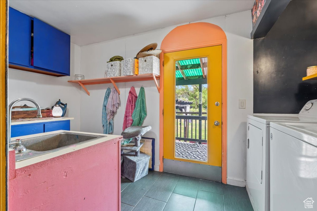 Laundry room with washing machine and clothes dryer and cabinet space