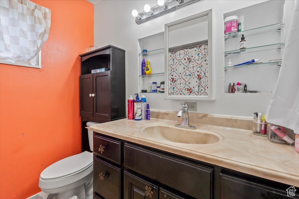 Full bath with vanity and toilet