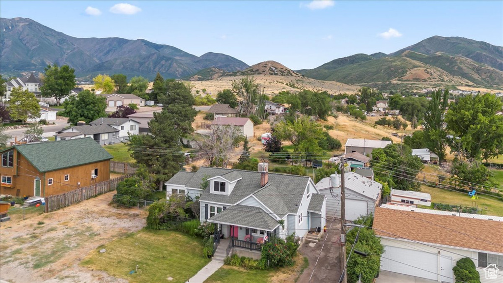 Aerial perspective of suburban area with a mountainous background