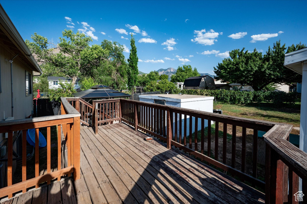 Wooden terrace featuring a mountain view