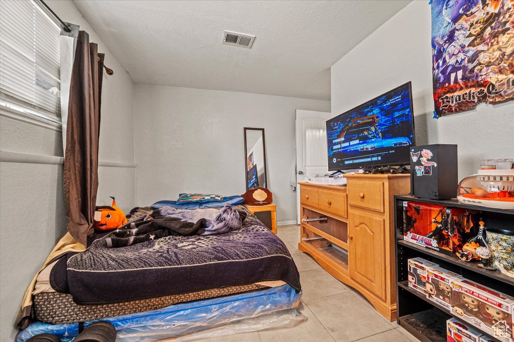 Bedroom featuring light tile patterned floors