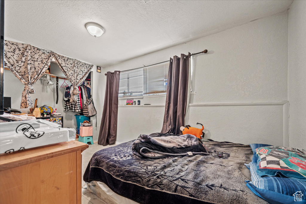 Bedroom featuring a textured ceiling