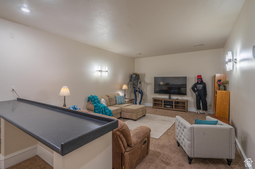 Living room with carpet floors and baseboards