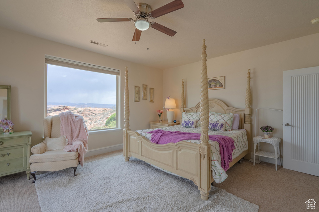 Bedroom with light carpet and ceiling fan