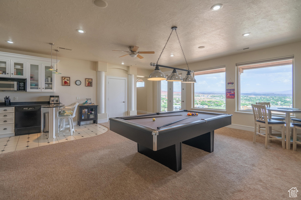 Recreation room featuring recessed lighting, a textured ceiling, billiards, bar, and ceiling fan