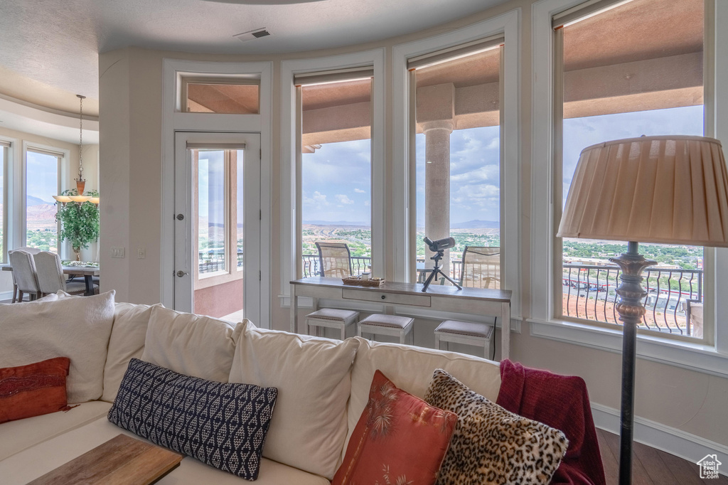 Living area featuring baseboards and wood finished floors