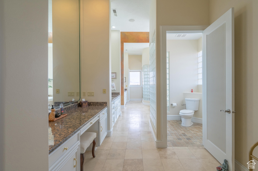 Full bath featuring vanity and tile patterned flooring