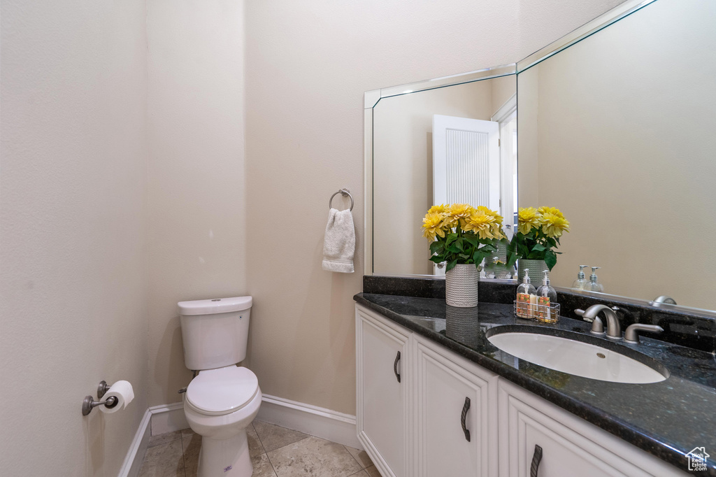 Bathroom featuring vanity and toilet