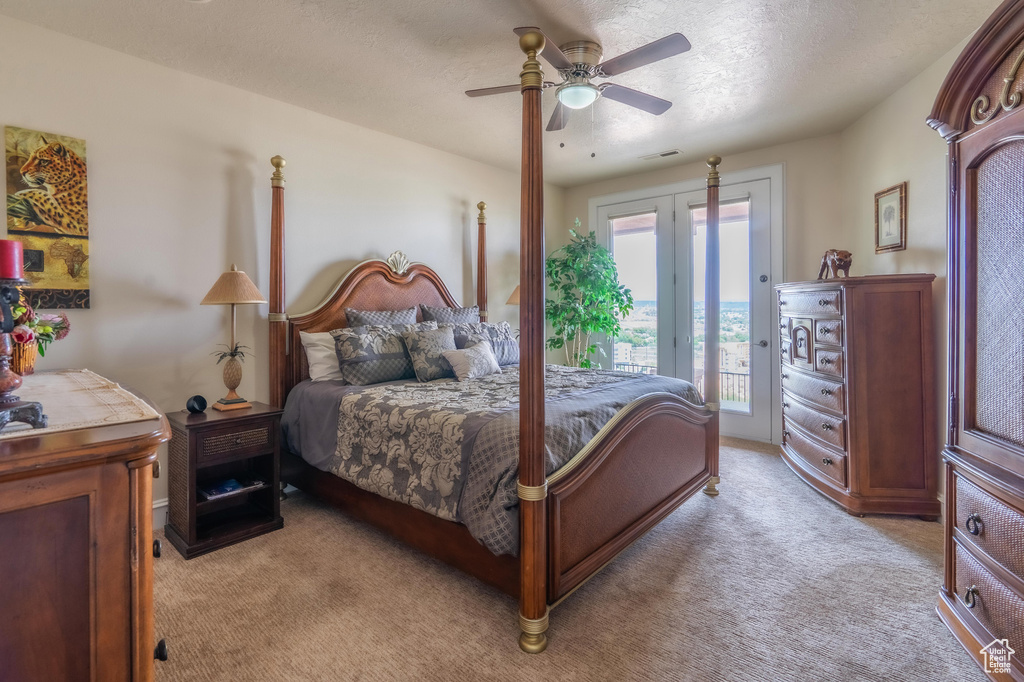 Bedroom featuring access to exterior, light carpet, and ceiling fan