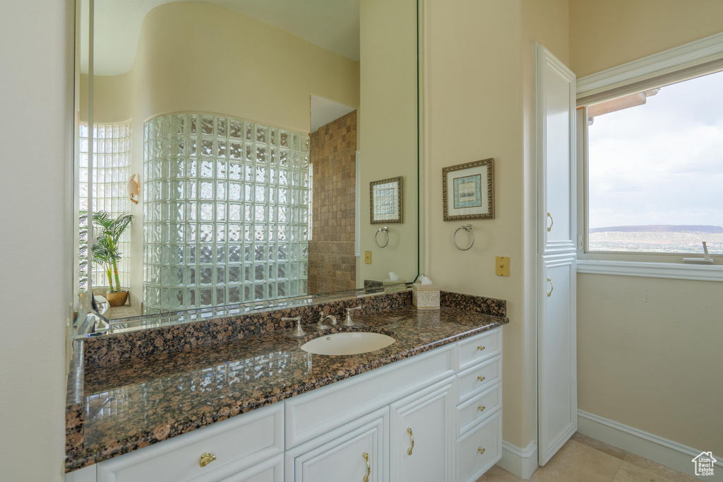 Bathroom featuring vanity and baseboards